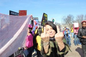 Womens Marcher flipping us off