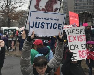 Women's Marcher with Jews for Justice sign